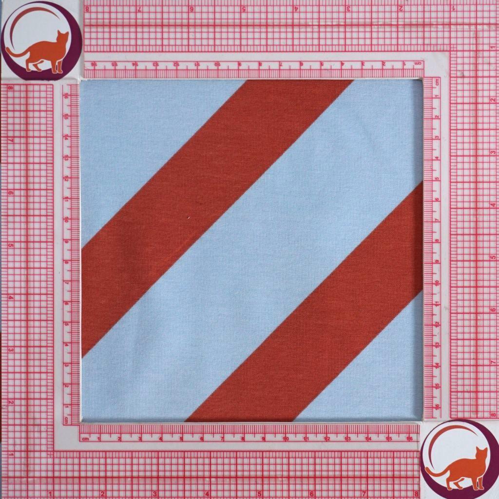 French Terry Blockstreifen diagonal hellblau rostrot